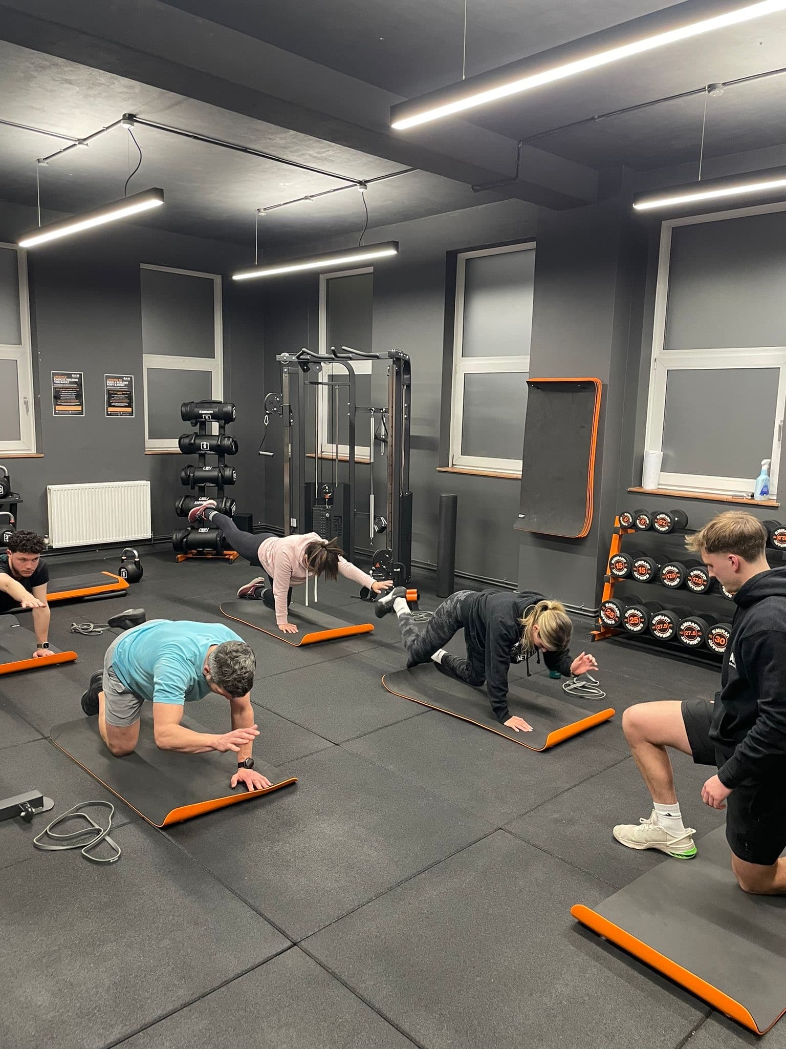 Hallum coaching a small-group class in the gym